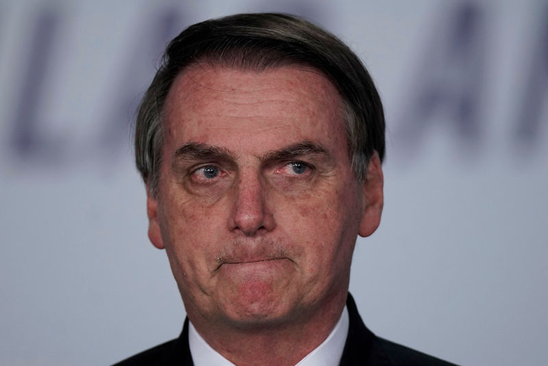 © Reuters. FILE PHOTO: Brazil's President Jair Bolsonaro attends a signing ceremony for 13.2 billion reais in contracts for electricity transmission lines, at the Planalto Palace in Brasilia