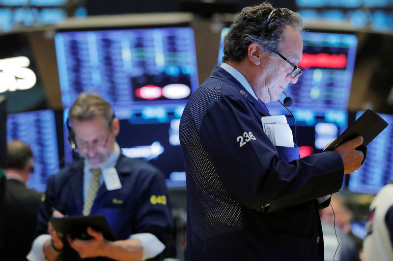 © Reuters. Traders work on the floor of the New York Stock Exchange (NYSE) shortly after the opening bell in New York