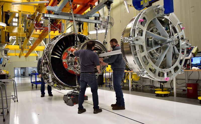 © Reuters. FILE PHOTO: Technicians build LEAP engines for jetliners at a new, highly automated General Electric (GE) factory in Lafayette