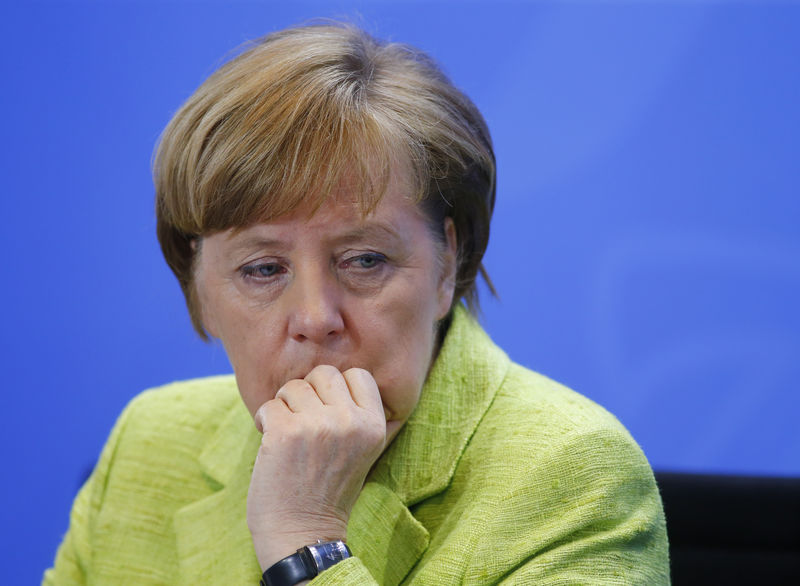 © Reuters. German Chancellor Merkel attends a news conference following a meeting of the heads of international economy and finance organisations at the Chancellery in Berlin