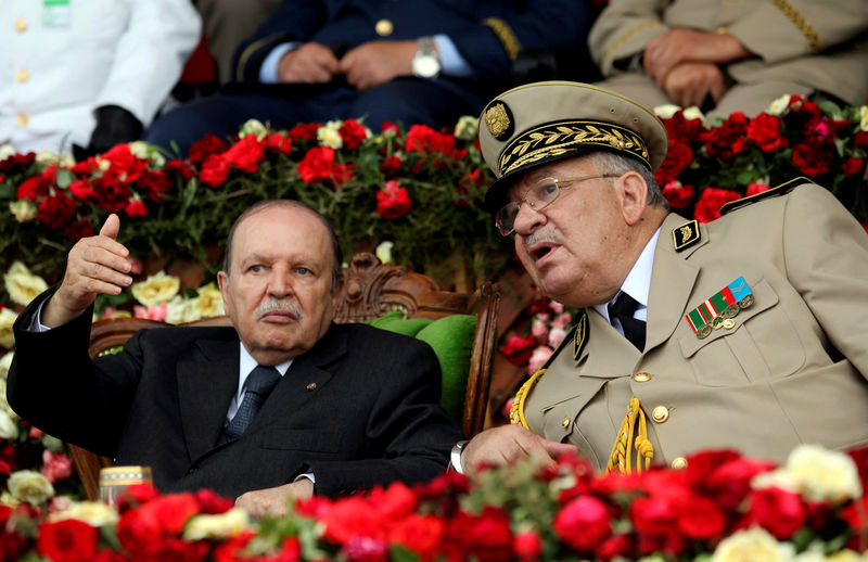 © Reuters. FILE PHOTO: Algeria's President  Abdelaziz Bouteflika gestures during a graduation ceremony of the 40th class of the trainee army officers at a Military Academy in Cherchell