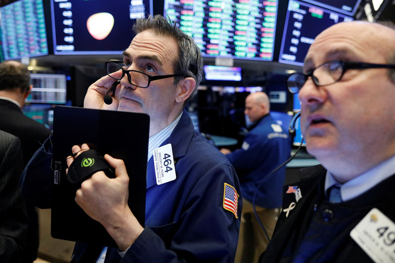 © Reuters. Traders work on the floor of the New York Stock Exchange (NYSE) shortly after the opening bell in New York