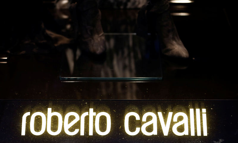 © Reuters. FILE PHOTO: A company logo is pictured outside a Roberto Cavalli store in Vienna