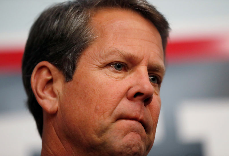 © Reuters. FILE PHOTO - Gubernatorial candidate Brian Kemp prepares to speak to volunteers and staff at his campaign office as they hold a phone banking event in Atlanta, Georgia, U.S.