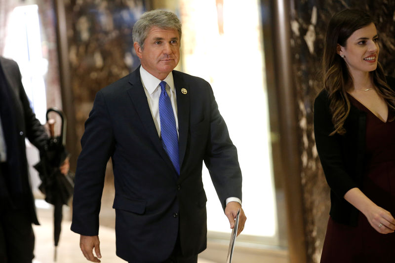 © Reuters. FILE PHOTO - U.S. Representative Michael McCaul (R-TX) is escorted by Madeleine Westerhout as he arrives at Trump Tower to meet with U.S. President-elect Donald Trump