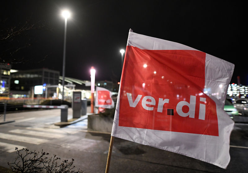 © Reuters. FILE PHOTO:  A flag of German union Verdi is pictured at the Helmut Schmidt airport during a strike of security personnel demanding higher wages in Hamburg