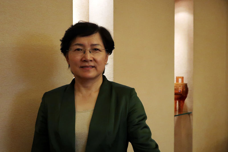 © Reuters. Li Yalan, chairwoman of Beijing Gas Group, poses for a picture during an interview with Reuters at the company headquarters in Beijing