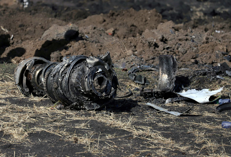 © Reuters. FILE PHOTO: Engine parts are seen at the scene of the Ethiopian Airlines Flight ET 302 plane crash, near the town of Bishoftu