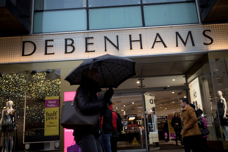 © Reuters. FILE PHOTO: Shoppers walk past the Debenhams department store on Oxford Street in London