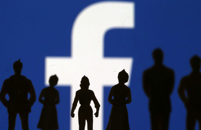 © Reuters. Small toy figures are seen in front of Facebook logo in this illustration picture