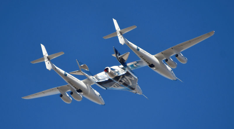 © Reuters. Virgin Galactic rocket plane, the WhiteKnightTwo carrier airplane, with SpaceShipTwo passenger craft takes off from Mojave Air and Space Port