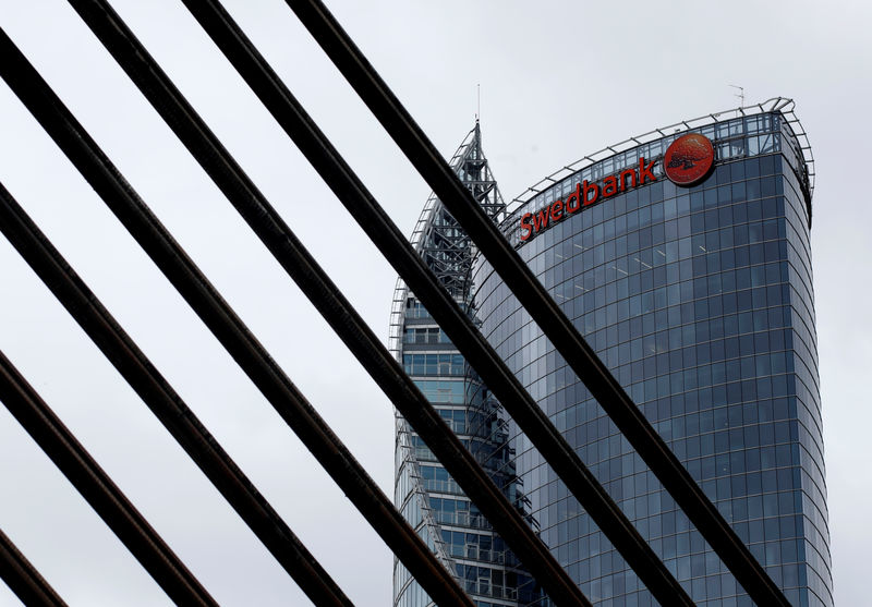 © Reuters. FILE PHOTO: Swedbank sign is seen on the top of the bank's Latvian head office in Riga