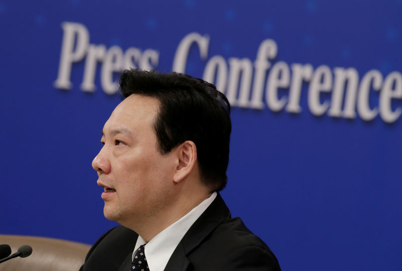 © Reuters. Chen Yulu, vice governor of the PBOC, attends a news conference during ongoing session of the NPC in Beijing