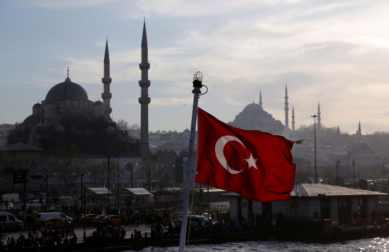 © Reuters. FILE PHOTO: A Turkish flag flies on a passenger ferry in Istanbul