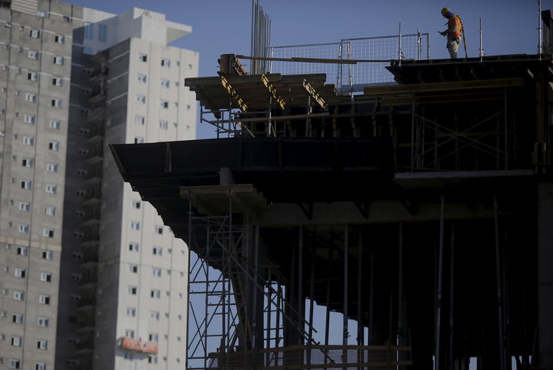 © Reuters. Employee works at a construction site for a residential building in Sao Paulo