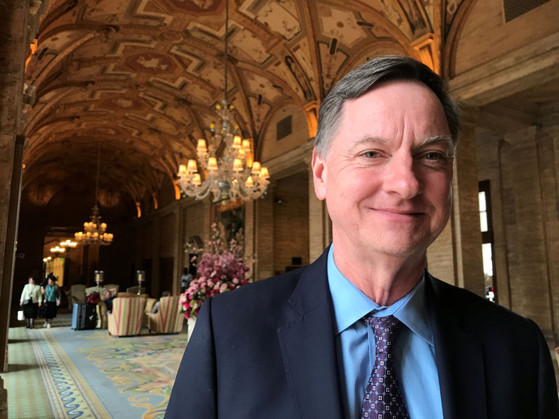 © Reuters. Charles Evans, president of the Federal Reserve Bank of Chicago, poses for a photo in Palm Beach