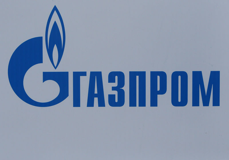 © Reuters. FILE PHOTO: The logo of Russian gas giant Gazprom is seen on a board at the SPIEF 2017 in St. Petersburg