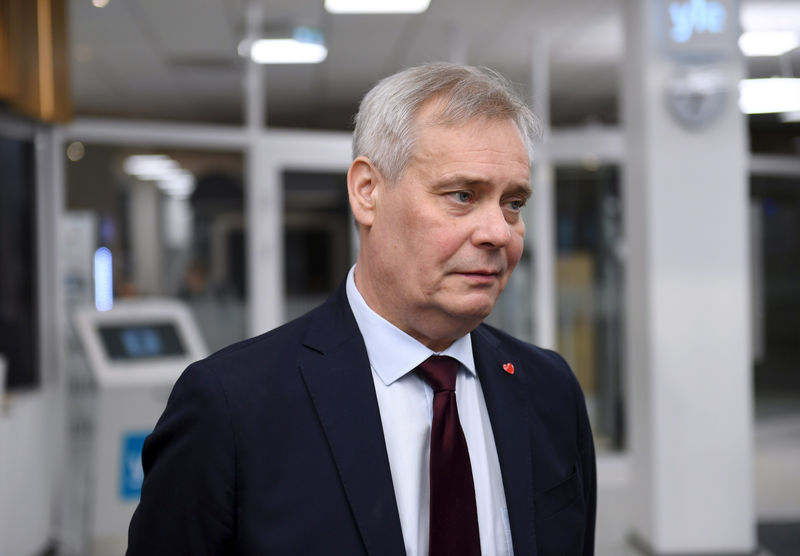 © Reuters. FILE PHOTO: Chairman of The Social Democratic Party Antti Rinne speaks to media at the Finnish Broadcasting Company Yle studios in Helsinki