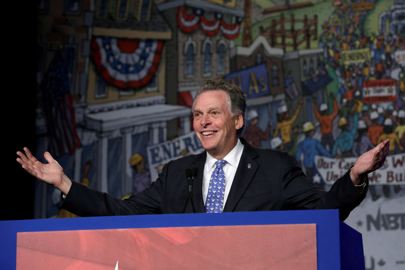 © Reuters. FILE PHOTO: Terry McAuliffe speaks at NABTU legislative conference in Washington