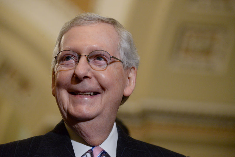 © Reuters. FILE PHOTO: Senate Majority Leader Mitch McConnell speaks with the press in Washington