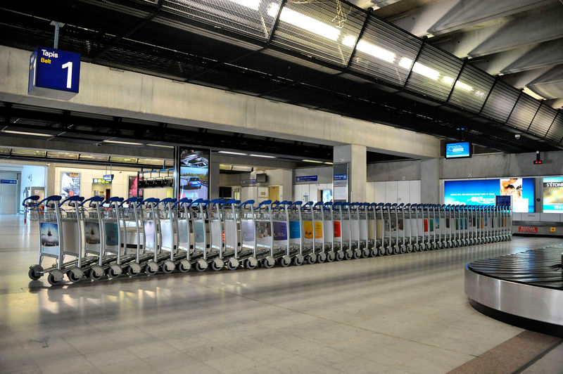 © Reuters. FILE PHOTO: Baggage trolleys are seen at the arrivals area at the Nice Cote d'Azur international airport in Nice