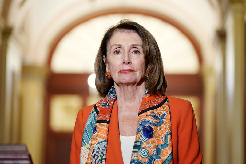 © Reuters. FILE PHOTO:    Speaker of the House Nancy Pelosi (D-CA) stands during a meeting with European Parliament President Antonio Tajani on Capitol Hill in Washington