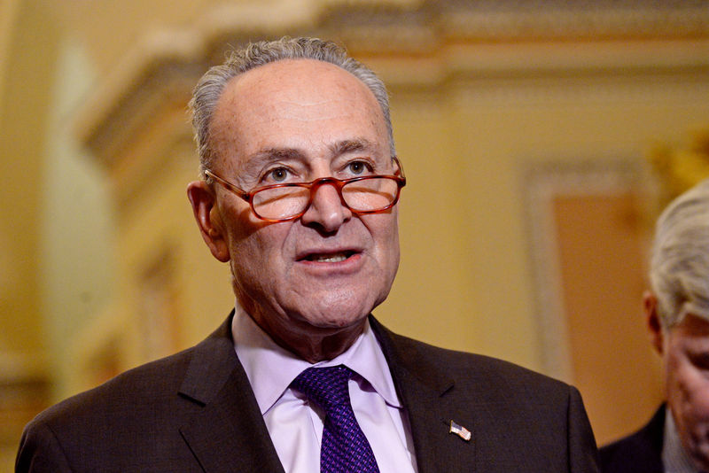 © Reuters. FILE PHOTO: Senate Minority Leader Chuck Schumer speaks with reporters