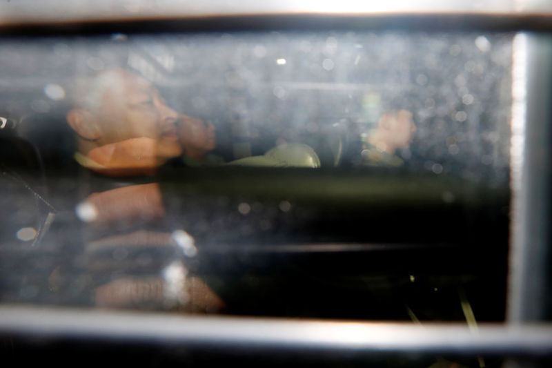 © Reuters. Occupy Central pro-democracy movement founder Benny Tai is seen inside a prison van leaving the High Court in Hong Kong