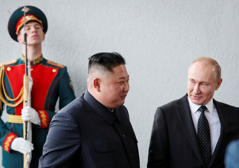 © Reuters. Russia's President Vladimir Putin walks with North Korea leader Kim Jong Un at the Far Eastern Federal University campus at Russky Island in the far eastern city of Vladivostok