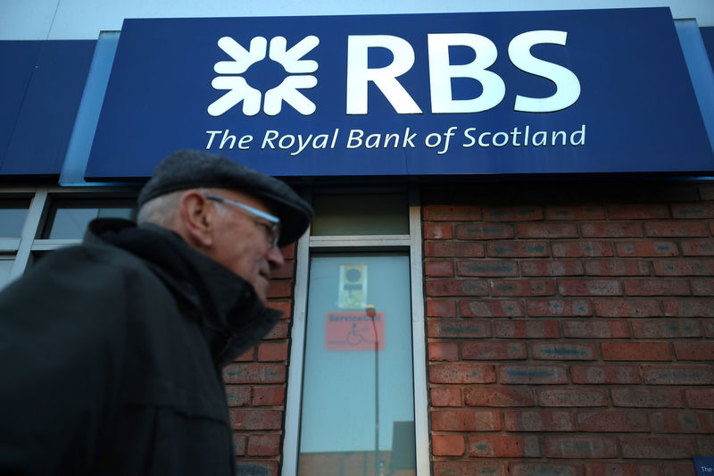 © Reuters. A person walks past a branch of RBS bank in Nottingham
