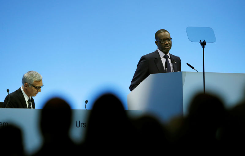 © Reuters. Chairman Urs Rohner listens as CEO Thiam of Swiss bank Credit Suisse addresses the company's annual shareholder meeting in Zurich