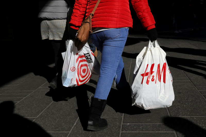 © Reuters. FILE PHOTO: People are seen with shopping bags in Times Square in New York