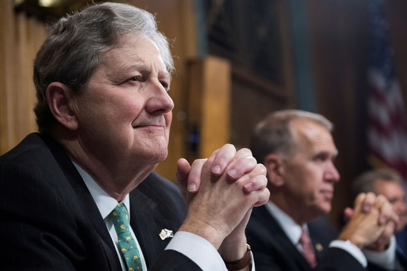 © Reuters. Sen. John Kennedy, R-La., listens to Judge Brett Kavanaugh during the Senate Judiciary Committee hearing on his nomination be an associate justice of the Supreme Court of the United States, on Capitol Hill in Washington