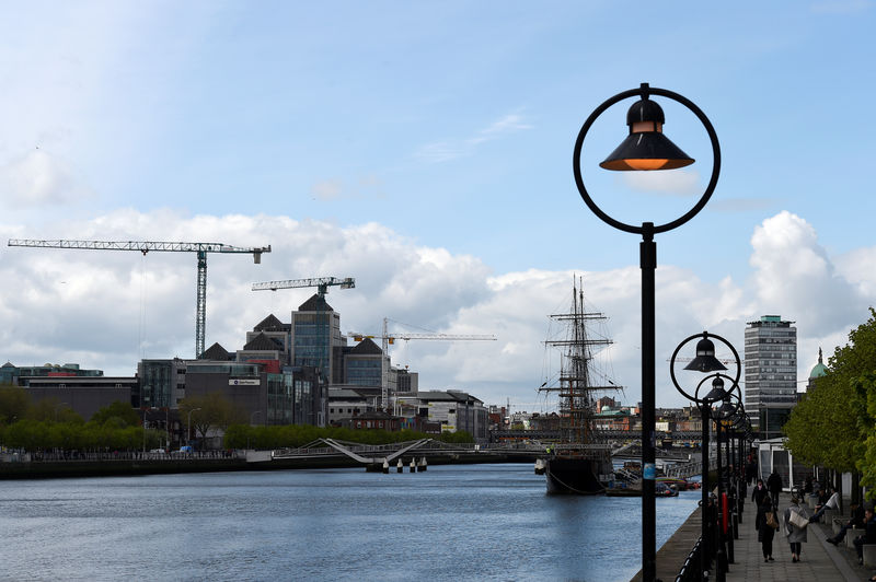 © Reuters. FILE PHOTO: Construction cranes are seen in the Irish Financial Services Centre in Dublin