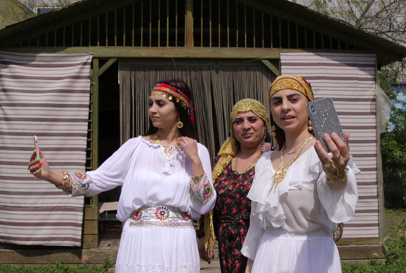 © Reuters. A family of Romanian witches livestream a ritual on Facebook for their followers, in Mogosoaia