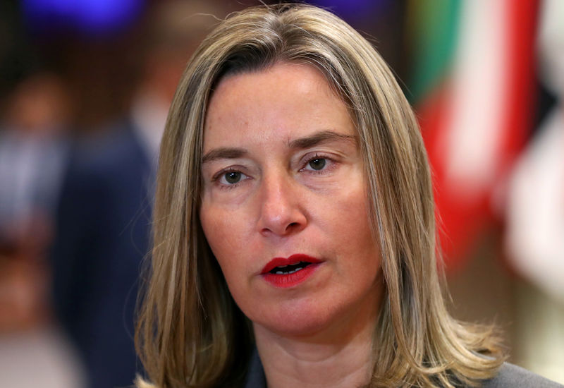 © Reuters. EU High Representative for Foreign Affairs and Security Policy Federica Mogherini talks to media at the European Council headquarters before a meeting with Chinese Foreign Minister Wang Yi, in Brussels