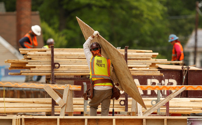 © Reuters. Construction workers are seen at a new building site in Silver Spring, Maryland