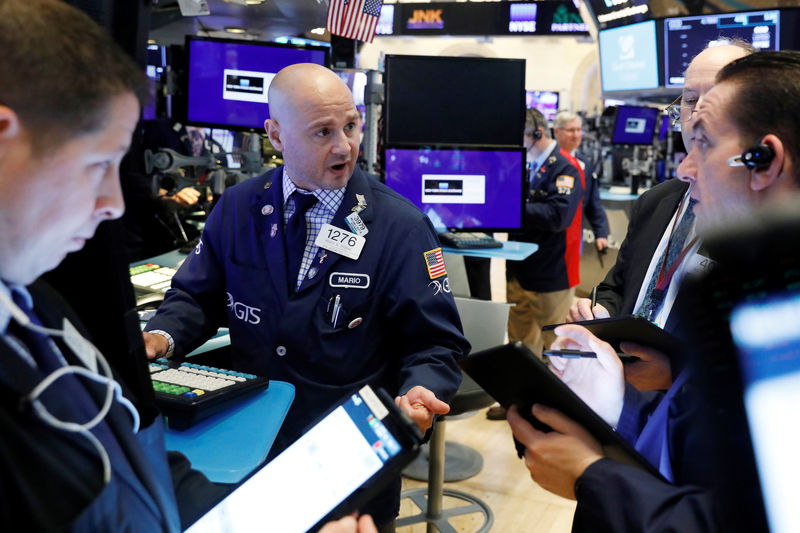 © Reuters. Traders work on the floor of the New York Stock Exchange shortly after the opening bell in New York