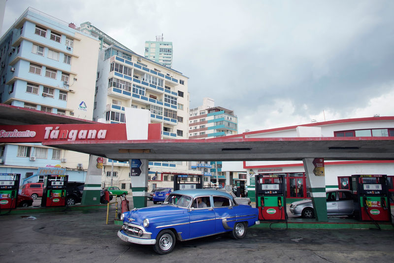 © Reuters. A vintage car leaves a gas station operated by Cimex corporation in Havana