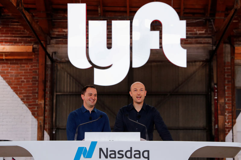 © Reuters. FILE PHOTO: Lyft President John Zimmer and CEO Logan Green speak as their company Lyft lists on the Nasdaq at an IPO event in Los Angeles