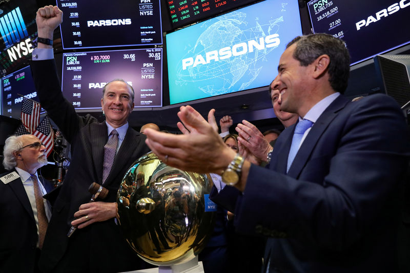 © Reuters. Charles Harrington, Chairman, CEO and President of the Parsons Corporation, celebrates his company's IPO at the NYSE in New York
