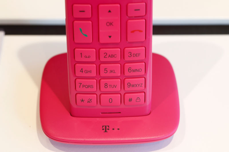 © Reuters. Wireless home phone in brand magenta colour of Deutsche Telekom is pictured in the shop, at headquarters of the German telecommunications giant in Bonn