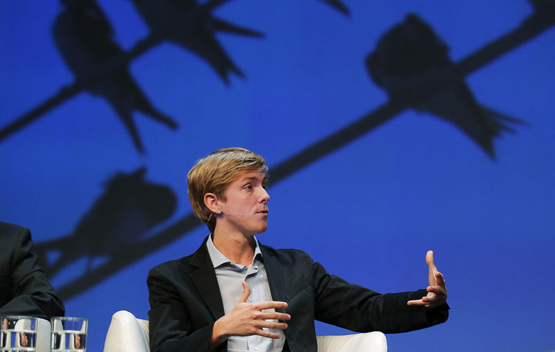 © Reuters. FILE PHOTO: Chris Hughes, co-founder of Facebook, speaks at the Charles Schwab IMPACT 2010 conference in Boston