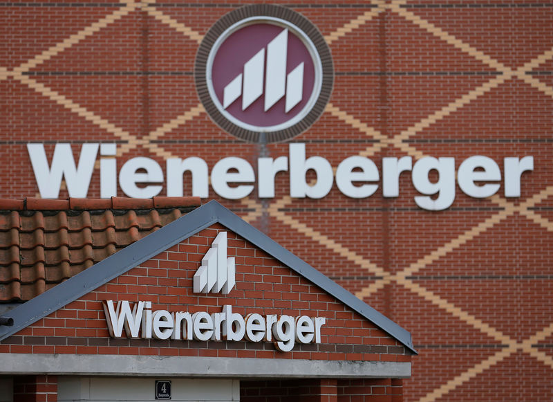 © Reuters. FILE PHOTO: Logos of Wienerberger, the world's biggest brick maker, are pictured at its headquarters in Hennersdorf