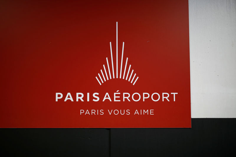 © Reuters. An Aeroports de Paris logo hangs on the wall inside Charles de Gaulle airport, operated by Aeroports de Paris, in Roissy