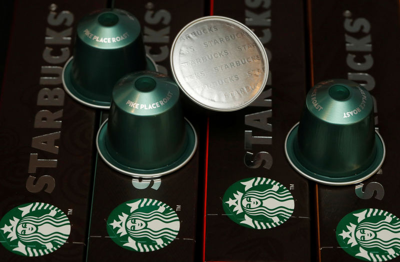 © Reuters. FILE PHOTO: Starbucks labeled single-serve coffee capsules for Nespresso coffee makers are displayed after a news conference at Nestle's headquarters in Vevey