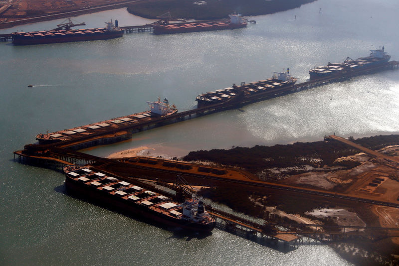 © Reuters. FILE PHOTO: Ships waiting to be loaded with iron ore are seen at Port Hedland in the Pilbara region of Western Australia