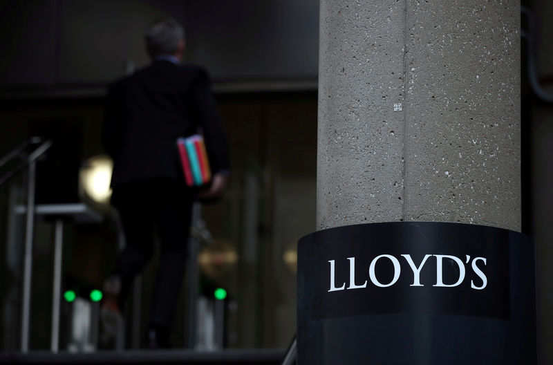 © Reuters. FILE PHOTO: A man enters the Lloyd's of London building in the City of London financial district