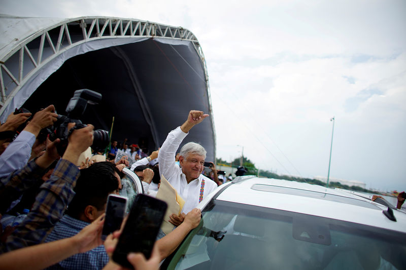 © Reuters. FILE PHOTO: Mexico's new President Andres Manuel Lopez Obrador reacts to supporters after an event to unveil his plan for oil refining in Paraiso