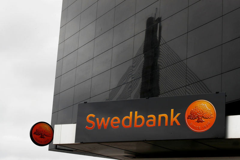 © Reuters. Swedbank signs are seen on the bank's Latvian head office in Riga
